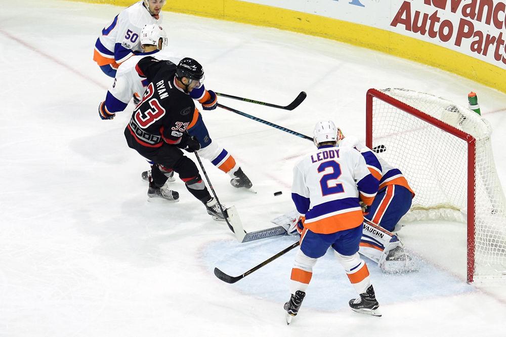 Hurricanes forward Derek Ryan rushes the net during the games against the Islanders on Jan. 14 in PNC Arena. Ryan recorded a 57% face-off win percentage in the Hurricanes 8-5 victory.