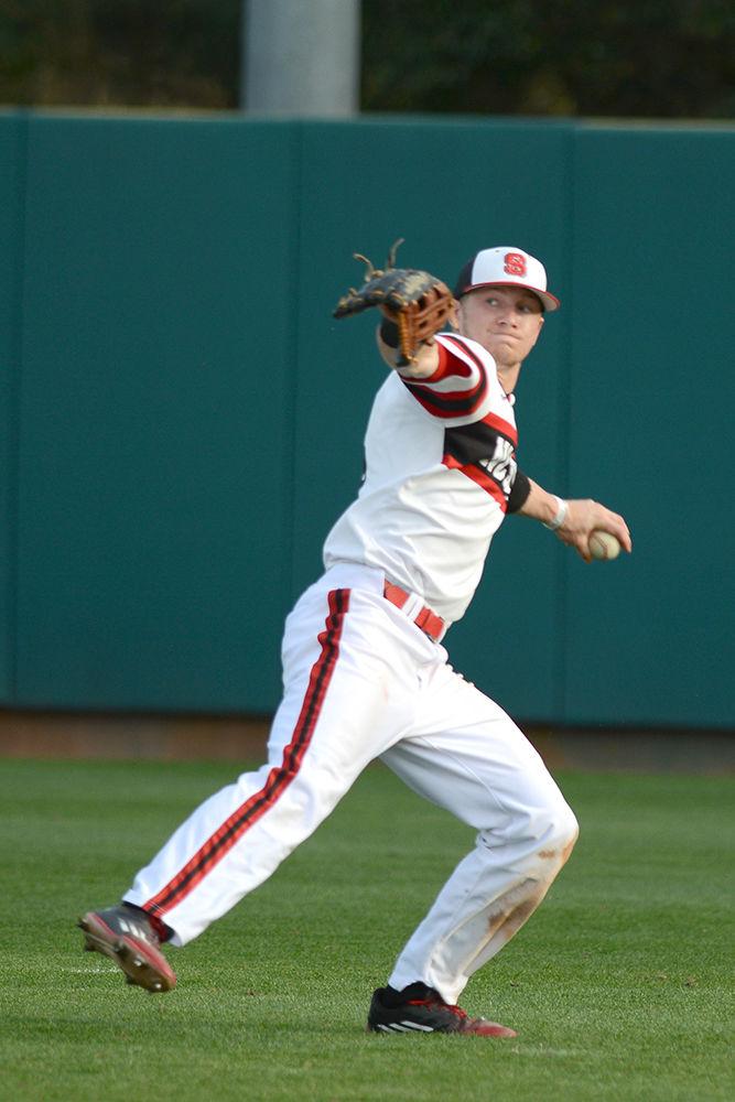 Sophomore outfielder Brock Deatherage throws the ball back to infield after catching a pop fly. The NC State baseball team lost to Indiana State 11-7 at Doak Field on March 16.
