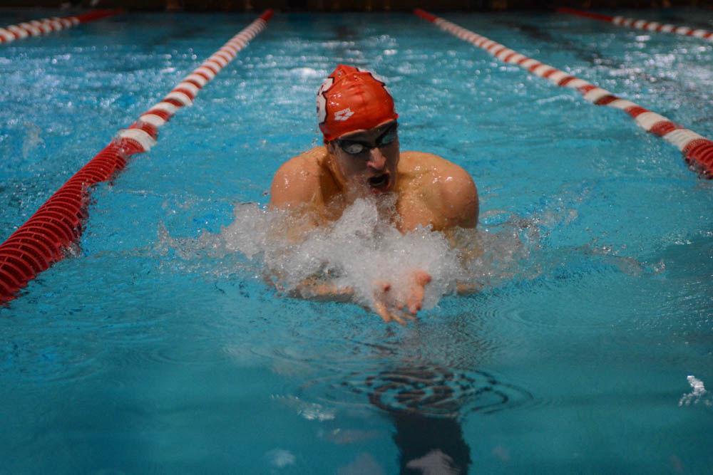 Senior Derek Hren swims against UNC-Chapel Hill in the 100 yard breaststroke event in the Willis R. Casey Aquatic Center on Jan 27, 2017. Hren came in first in the 100 yard breaststroke event with the time of 54.10 seconds. The meet between the Wolfpack and the Tar Heels ended with the Wolfpack winning 26 of 32 events.