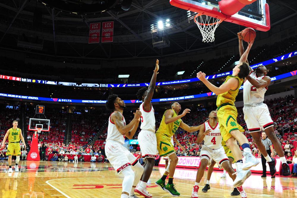 Torin Dorn, an NCSU redshirt sophomore, blocks Steve Vasturia's shot at the PNC Arena. Torin Dorn finished the game with 3 points and 4 rebounds as the Wolfpack fell to the Fighting Irish.