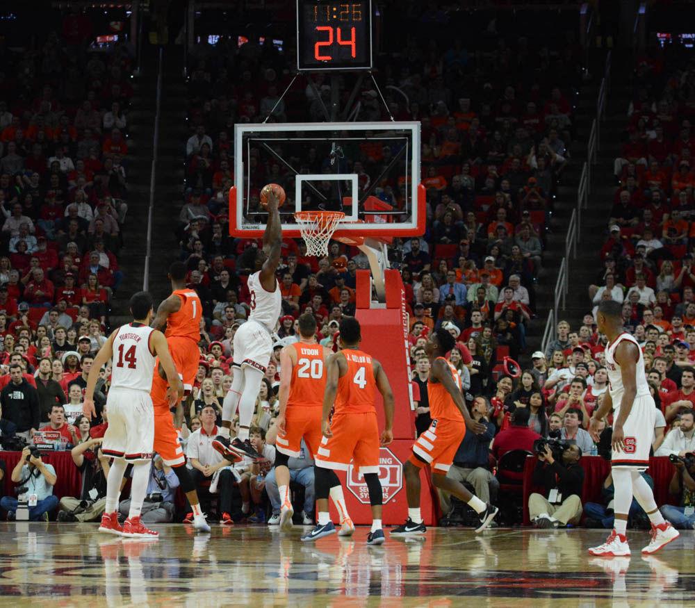 Abdul-Malik Abu goes for a dunk over pkayers from Syracuse. The Men's Basketball team played strong but fell to Syracuse in overtime in the ACC matchup on Wednesday in PNC Arena.