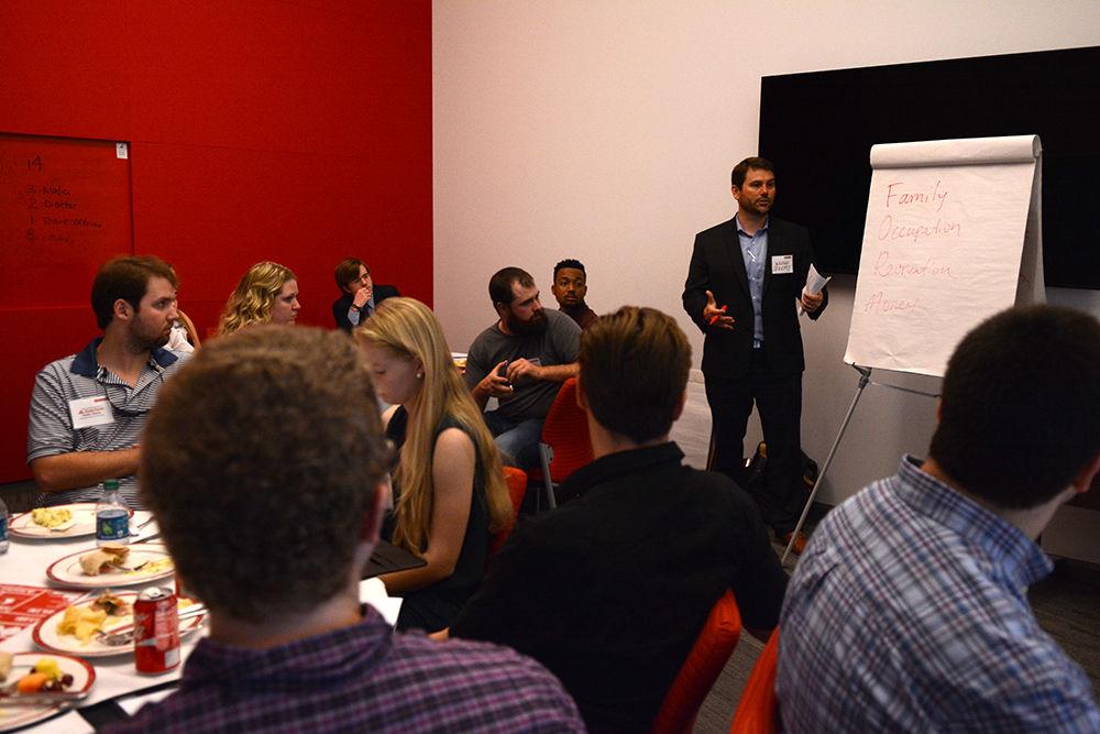 Jeremy Fulkerson, a State Farm Agent from Charlotte, talks about topics to discuss in the sales and marketing discovery process during a workshop of the State Farm Sales and Marketing Academy in room 3221 in Talley Student Union Friday. According to Fulkerson, the purpose of the Academy is for State Farm and NC State to partner and provide students sales and marketing and entrepreneurship skills they can use not only as a student but also for building career skills. "I thoroughly enjoyed the experience and the great connections that I gained" said Brendan Gallagher, a sophomore studying business administration, when asked about his experience with the workshop. According to Kara Powell, Employees Relations Assistant with the Career Development Center, this is the second year the academy has taken place at NC State. Other workshops will be held March 17 and March 31 from 12:30-2:30 p.m. State Farm Agents from across the state will act as mentors for the students and will assist them throughout the semester for a sales and marketing competition. The final competition will take place on April 21 and the winner will win a MacBook computer and private dinner with State Farm agents and sales leaders and may qualify for a national sales competition with State Farm Insurance.
