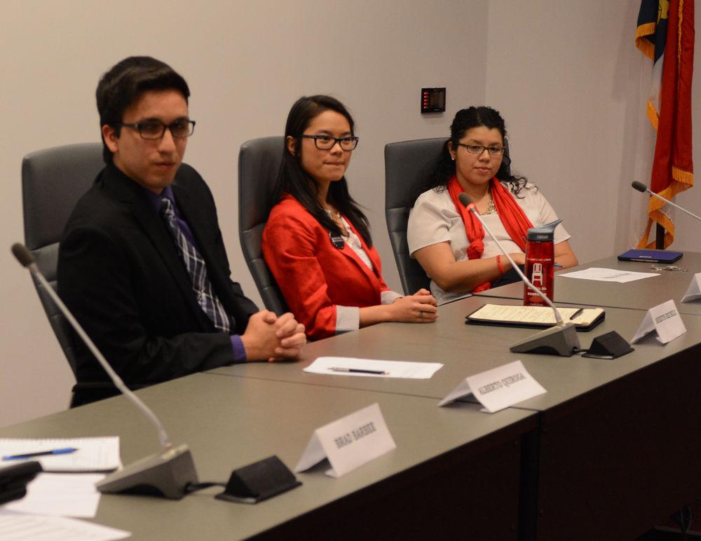 Presidential candidates Alberto Quiroga, Meredith Biechele, and Jackie Gonzalez listen during the Student Government debate on Feb. 21 in the Student Senate Chamber in Talley Student Union. The debate allowed candidates for Student Body President, Vice President, and Chief Justice to answer questions and speak about their campaigns.