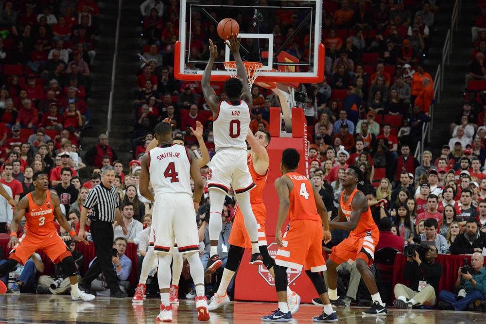 Abdul-Malik Abu goes for two points in the second half versus Syracuse. Abu was one of the top scoring players of the Wolfpack with a total of 19 points; the Men's Basketball fell in another ACC game with a final score of 100-93 on Wednesday in PNC Arena.