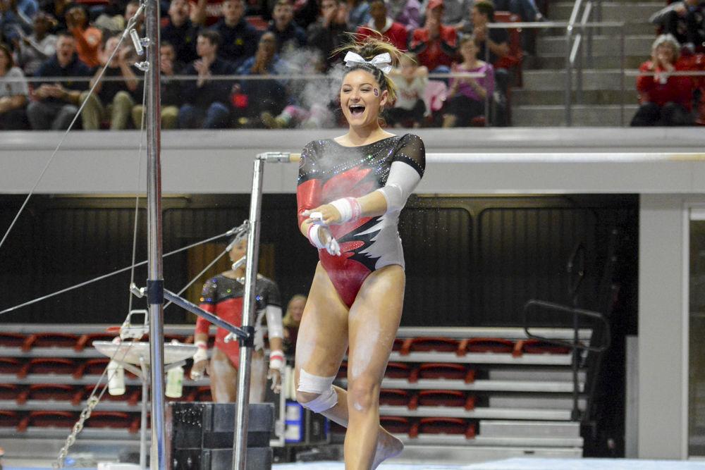 Senior gymnast Amanda Fillard, claps her hands together, celebrating her pefect landing in the uneven bars event at Reynolds Coliseum on Feb. 10. In the quad meet with William &amp; Mary, Pittsburgh, and UNC-Chapel Hill, Fillard finished second on the uneven bars with the score of 9.875. The meet ended with Wolfpack coming in second, with a score of 195.025, behind UNC-Chapel Hill with 195.625 points and ahead of Pittsburgh with 194.075 points, and William &amp; Mary with 193.025 points.