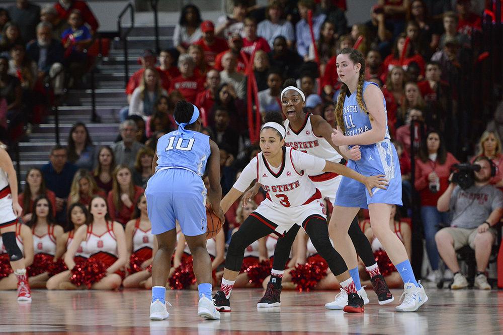 Senior guard Miah Spencer &#160;defends a UNC-Chapel Hill player during the game in Reynolds Coliseum on Thursday. Spencer had a total of four rebounds and nine assists throughout the game. The Wolfpack defeated the Tar Heels with a score of 80-60.