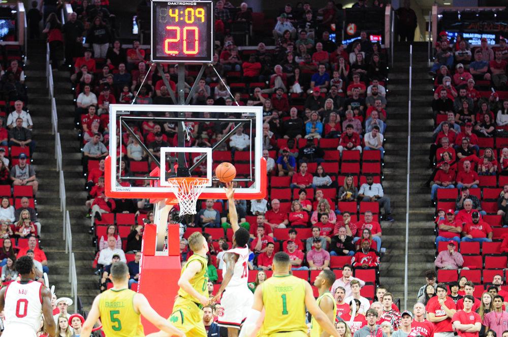 North Carolina State's freshman, Markell Johnson, scores a layup as time winds down during Saturday's conference game against Notre Dame. The Fighitng Irish won the game 81 to 71.