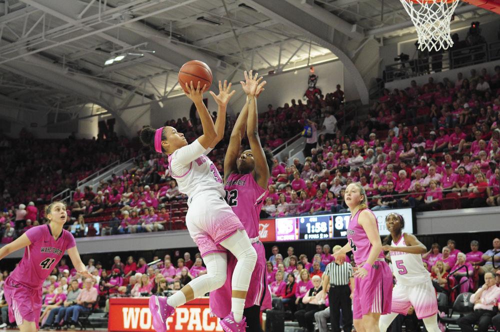 Senior gaurd Miah Spencer draws contact as she puts up a layup in the Pink Game against Wake Forest on Feb. 19. Spencer finished the contest with 24 points and 7 rebounds against Wake Forest in Reynolds Coliseum.