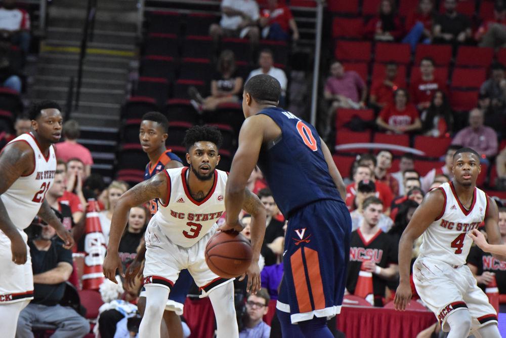 Terry Henderson, a redshirt senior guard, plays tight defense against Virginia in PNC Arena on Feb. 25. Henderson had four rebounds in the game. The Pack was defeated, 70-55.