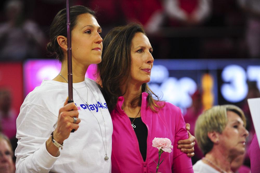 Former NC State basketball player Hanna Halteman stands with her mother JoEllen Halteman as she is honored at halftime of the Play4Kay game at Reynolds Colisuem on Feb. 19. JoEllen has been cancer free for a year and a half.