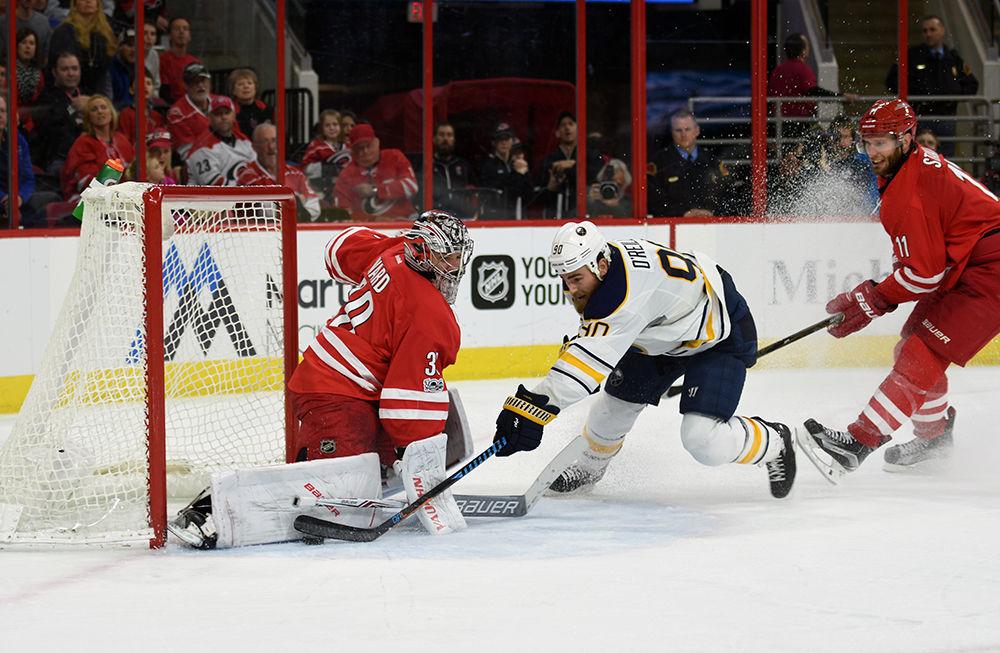 Hurricanes goalie Cam Ward stops a shot by Sabres forward Ryan O'Reilly on Friday in PNC Arena. Ward made 36 saves in the Hurricanes 5-2 victory over Buffalo. Friday's win also marked Ward's 600th game in the NHL, all of which he played for the Hurricanes.