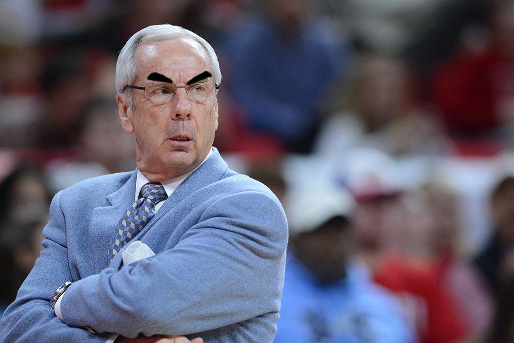 Head coach, Roy Williams, angrily stares down his players, something he has done a lot this season. The campaign #MakeRoySmileAgain will hopefully pay off in getting the second greatest UNC head coach back on the sidelines.
 