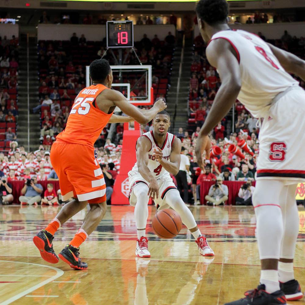 Freshman guard Dennis Smith Jr. completes a bounce pass through the defense to junior forward Abdul-Malik Abu during the 100-93 loss to Syracuse on Feb. 1 in PNC Arena.