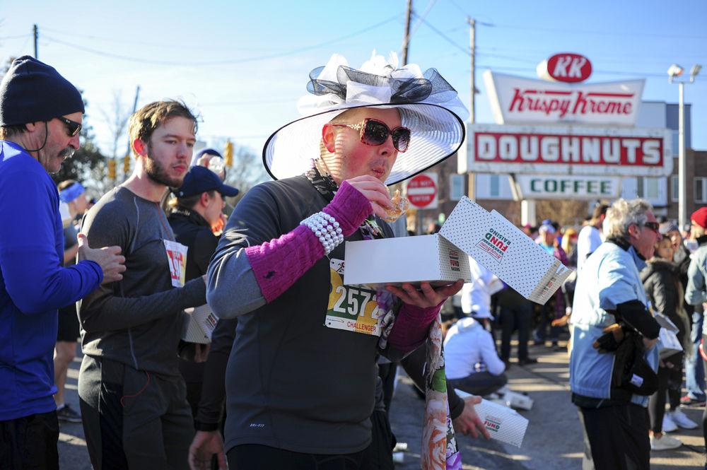 A Raleigh local, Josh Engle, eats his last doughnut for the Krispy Kreme Challenge on Feb. 4. The Krispy Kreme Challenge registered 2629 challengers and over 6900 participants total this year.
