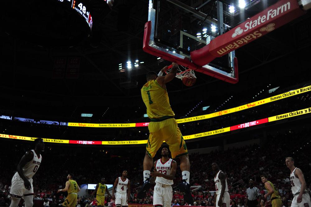 Austin Torres of the Fighting Iris dunks the ball agains the Wolfpack in Saturday's contest. The Wolfpack struggled from behind the arc making on 3 of 14 attempts.