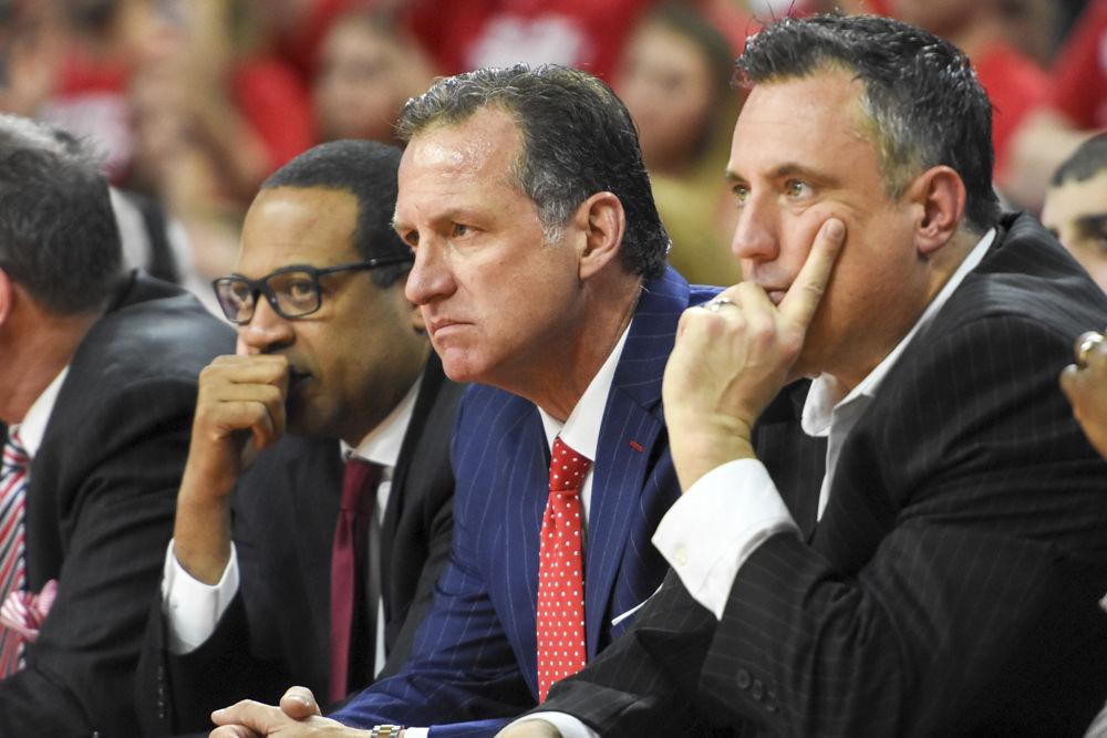 Head coach Mark Gottfried sits on the bench with his assistant coaches during the second half of the Wolfpack's 97-73 loss to UNC-CH on Feb. 15. The Wolfpack shot just 44 percent from the field in the loss at PNC Arena.