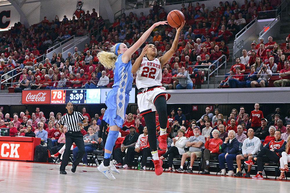 Redshirt senior guard Dominique Wilson drives the ball to the basket during the game against the Tar Heels. Wilson lead the team with a total of 19 points during the game on February 23, 2017 in Reynolds Coliseum. The Wolfpack dominated the Tar Heels with a score of 80-60.