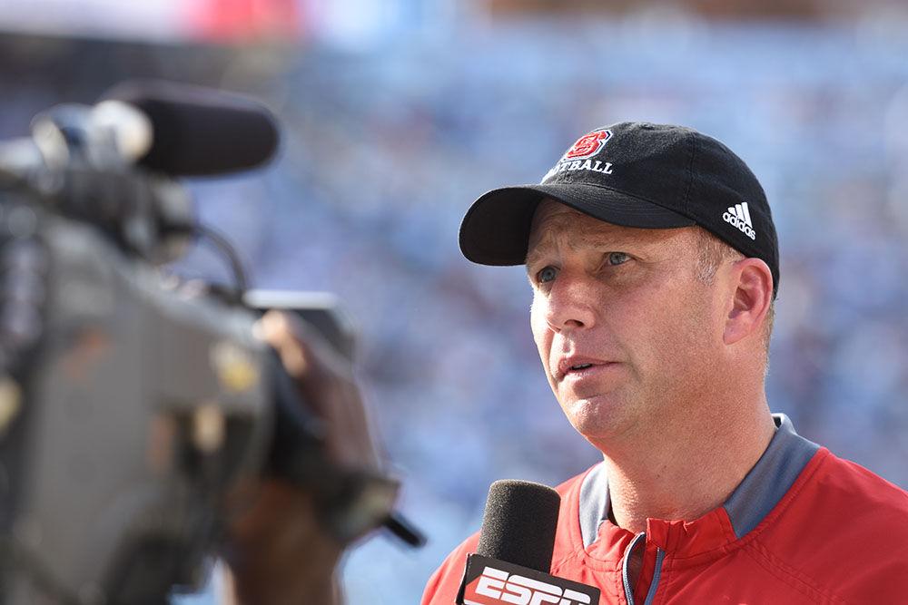 Football head coach Dave Doeren is relieved after the Wolfpack victory over UNC-Chapel Hill on Friday, Nov. 25. Since he began coaching at NC State, he has earned an 8-23 conference record. Of those eight wins, three have been at Carter-Finley Stadium and two have been at Kenan Memorial Stadium.