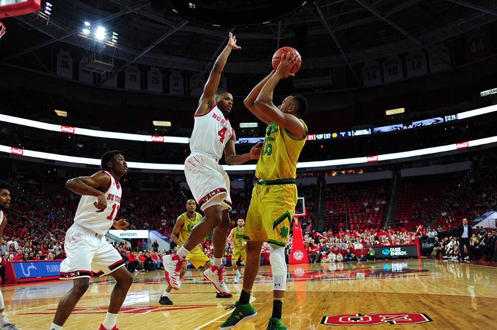 North Carolina State's star Dennis Smith Jr. attempts to block Notre Dame's Bonzie Colson. Dennis Smith Jr. finished Saturday's game with 16 points and 3 assists.