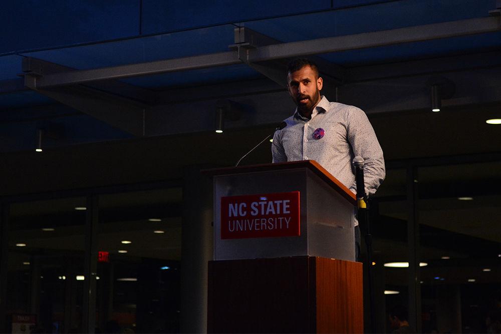 Safi Ahmed, a senior studying computer science, introduces the next speaker at the United Not Divided Ralley held on Stafford Commons on Monday. Ahmed worked as emcee during the rally and also led the prayer ritual that occurred halfway through the event.