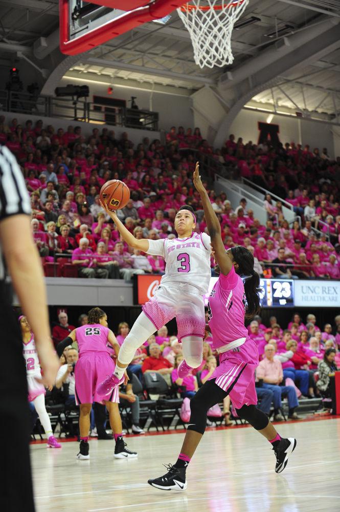 Senior guard Miah Spencer puts up an acrobatic layup in the Play4Kay game at Reynolds Coliseum on Sunday. Spencer finished the contest with 24 points and shooting 50 percent from the field.