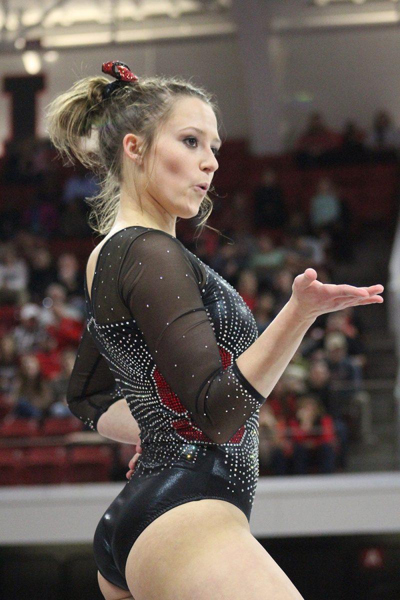 Sophomore Alexa Phillips blows a kiss during her floor routine. Phillips scored a 9.75 for this routine. NC State Wolfpack scored 194.850 and split between Ball State and William &amp; Mary on Jan. 20 in Reynolds Coliseum.&#160;