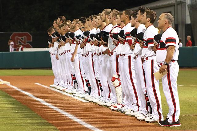 The team stands while the national anthem is played before the 0-4 loss to Coastal Carolina on June 4 on Doak Field.