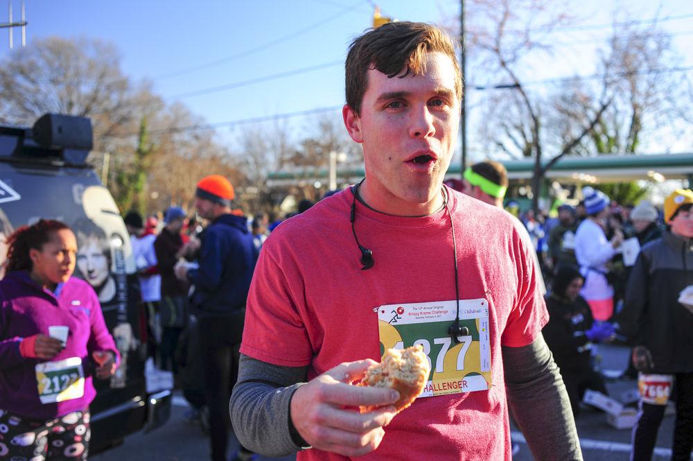 Raleigh local and recent NC State graduate, Hank Blodgett, eats all twelve doughnuts at once at the halfway point at the Krispy Kreme Challenge. The Krispy Kreme Challenge raise 97% of its $18,000 goal.