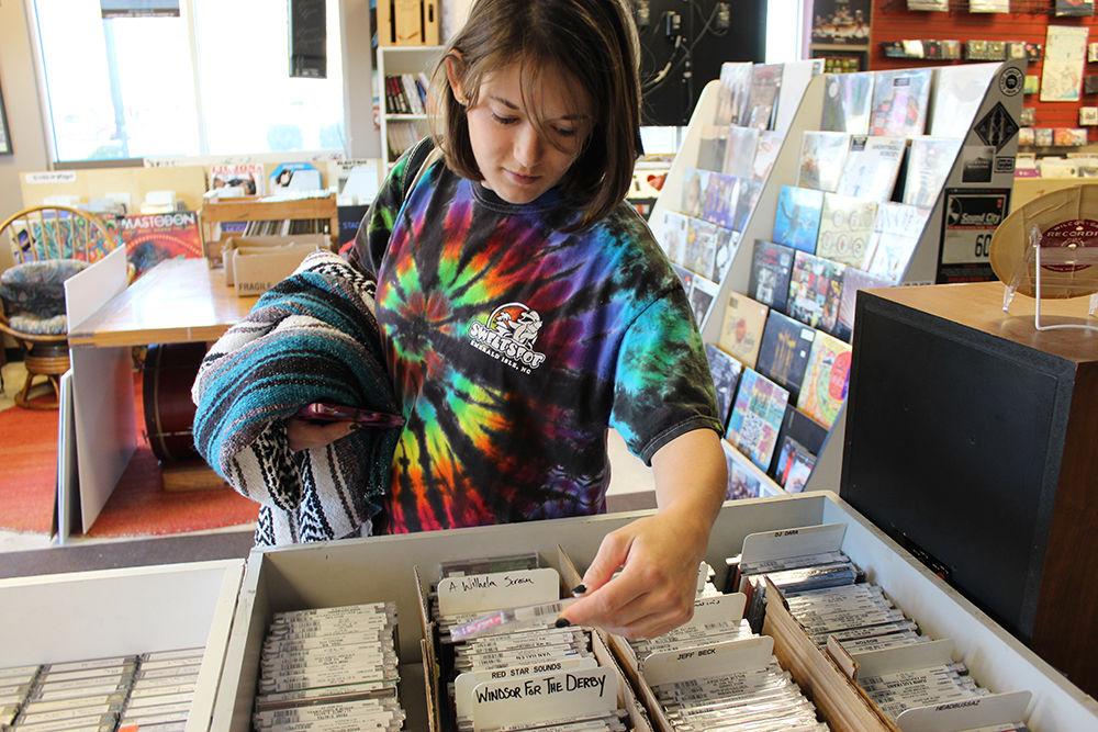 Nora Skinner, a freshman studying marine science, browses the CD section of Schoolkids Records on Feb 19. Skinner said "I liked that the shop had something for everyone, lots of older and new music."