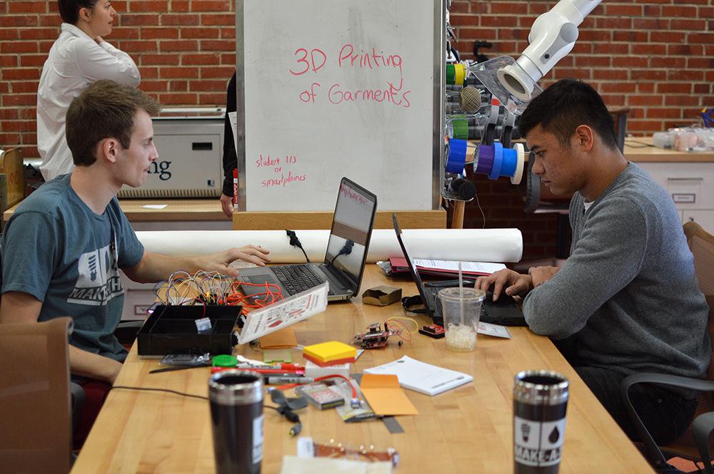 Julien Chomette, a senior studying electrical and computer engineering, and Jack Holgado, a senior studying electrical and computer engineering, write code and brainstorm in the Makerspace of D.H. Hill Library on Saturday. Make-A-Thon took place during the weekend of Feb. 2-5. Teams compete to research, design, prototype and build the best solution to a sustainability challenge in hopes to win a Desktop 3-D Printer and Starter Kit and win a consulting session with Aly Khalifa, NC State's social entrepreneur in residence.&#160;