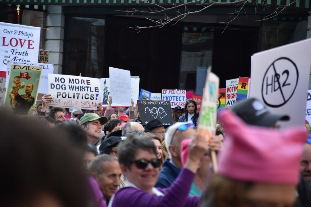 One protester showed how all people regardless of religion should be equal at the Moral March on Raleigh on Feb. 11, 2017, with a sign depicting the silhouette of three muslim students that were affiliated with NC State who were killed in 2015.