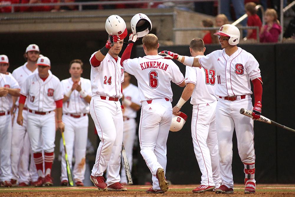 Freshman outfielder Brett Kinneman is welcomed back to the bench after hitting one out of the park. Kinneman had two at-bats, one of which resulted in the homer with two runners batted in. The Pack lost to UNC-Chapel Hill 16-4 on May 20 at Doak Field but won the series 2-1 overall.