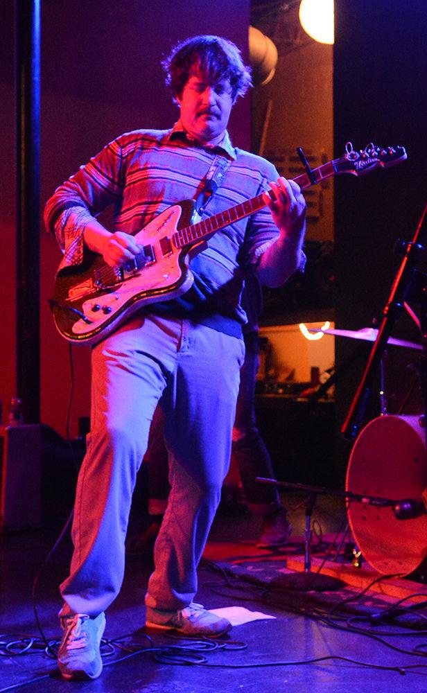 Lead vocalist and guitarist Reid Johnson of the band Schooner plays a guitar rift during the Double Barrel Benefit, on Saturday, Feb 13, 2016. The event was hosted in King&#8217;s to raise money for WKNC.
