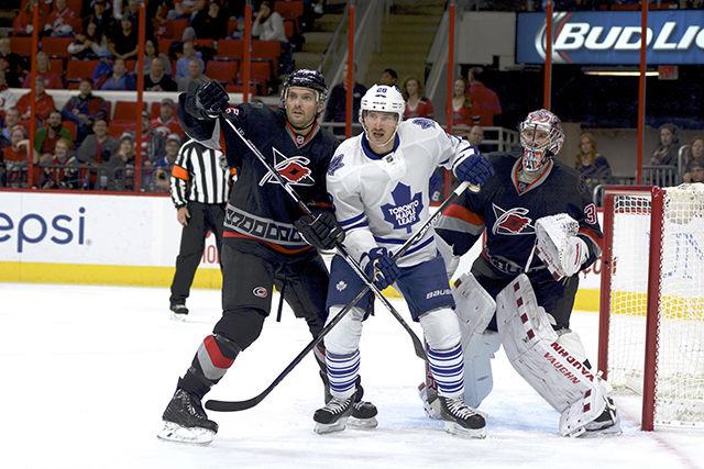 Defenseman Ron Hainsey covers Maple Leafs forward Brad Boyes during the third period Friday night at PNC Arena. All six starting defensemen were American born, with Hainsey being one of three non&#173;rookies. The Hurricanes were defeated in the shootout 2&#173;1.