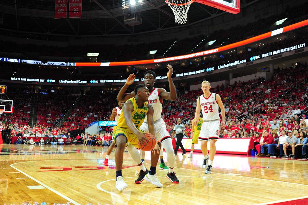 Abdul-Malik Abu plays close defense against Temple Gibbs of Notre Dame. The Wolfpack men's basketball team fell to the Fighting Irish, as the team struggle during the first half.