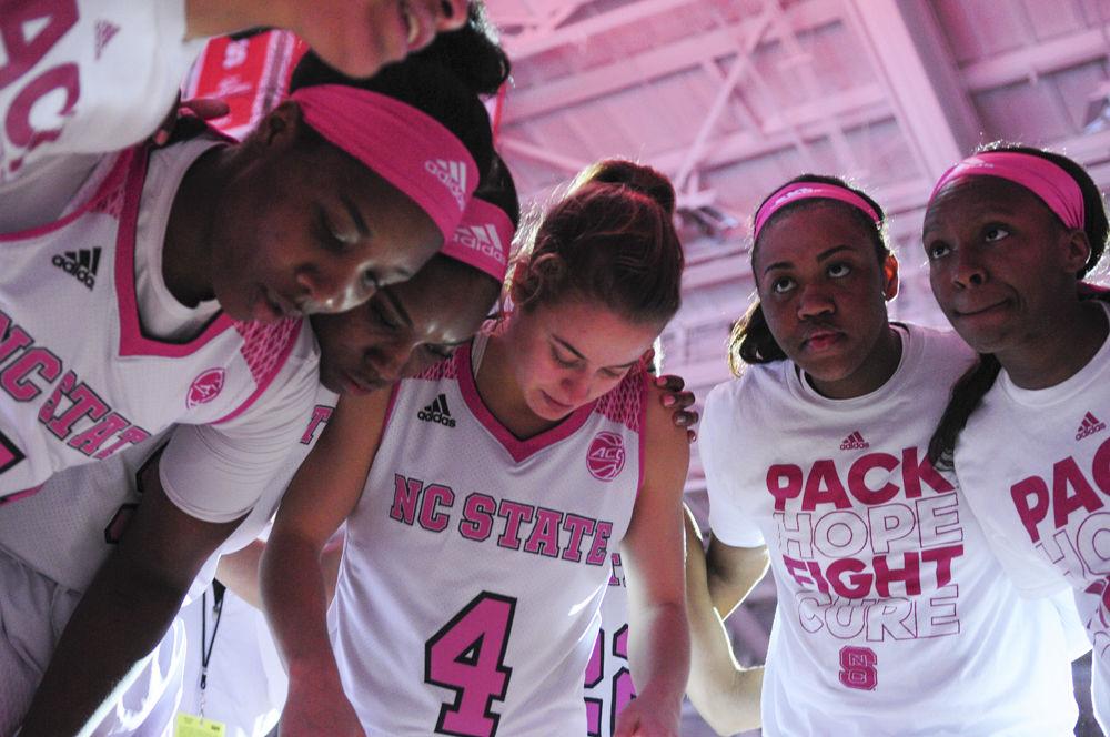 NC State's womens basketball team huddles up before the annual Play4Kay game on Feb. 19 in Reynolds Coliseum. The team lost 89 to 77 against Wake Forest and now holds a record of 20-7.