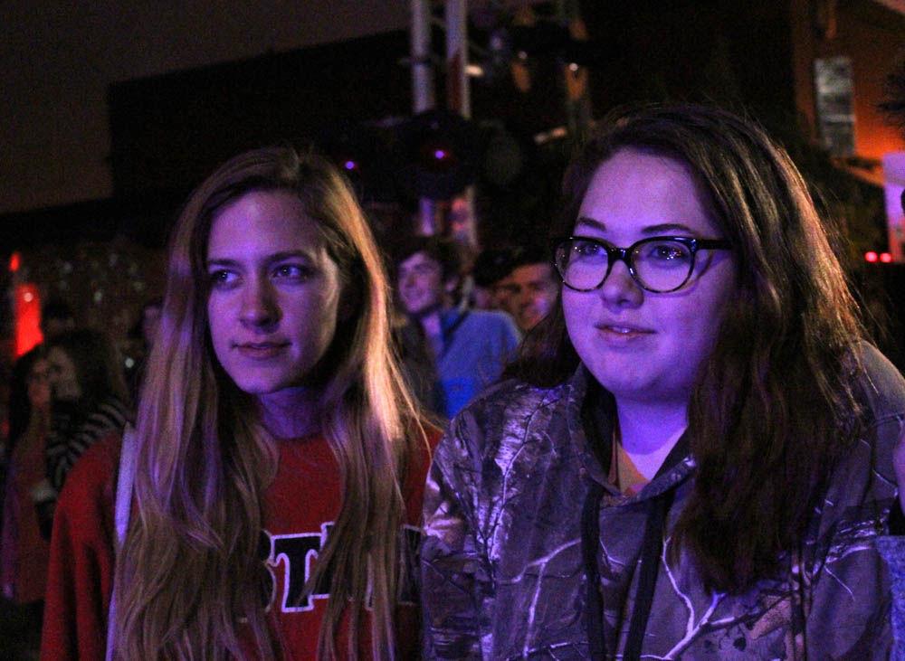 Lauren McBean, a graduate student studying middle grades language arts, watches with friends as an unfinished apartment building burns in downtown Raleigh on mar. 16. McBean said, " We were worried that our favorite restaurant was burning, so m friends and I ran over here to check."