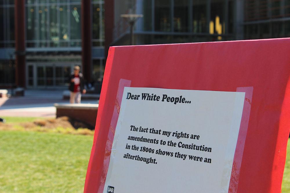 A sign from the "Dear White People" demonstration sits on Stafford Commons on Thursday. The event was sponsored by UAB Films and was intended to spark discussion about common racial stereotypes.