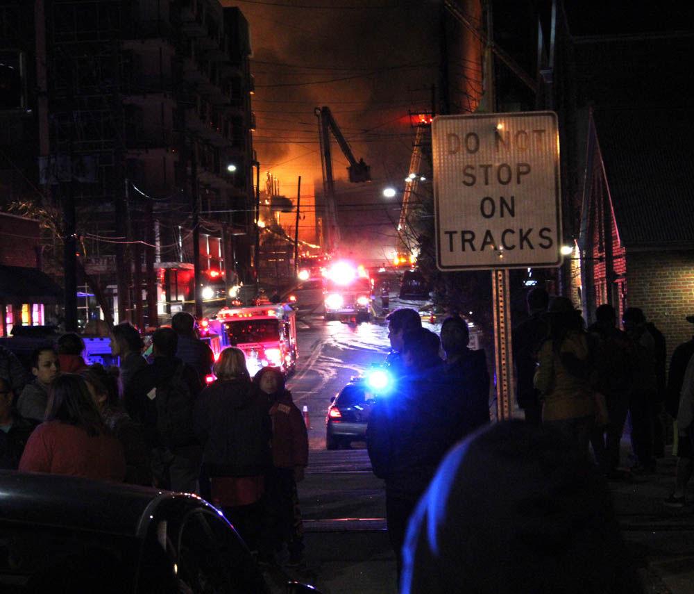 A massive fire broke out in an unfinished apartment building in downtown Raleigh on Thursday night around 10:30. The fire, which happened near Harrington Street, spread to the surrounding vegetation and rooftops of nearby buildings.