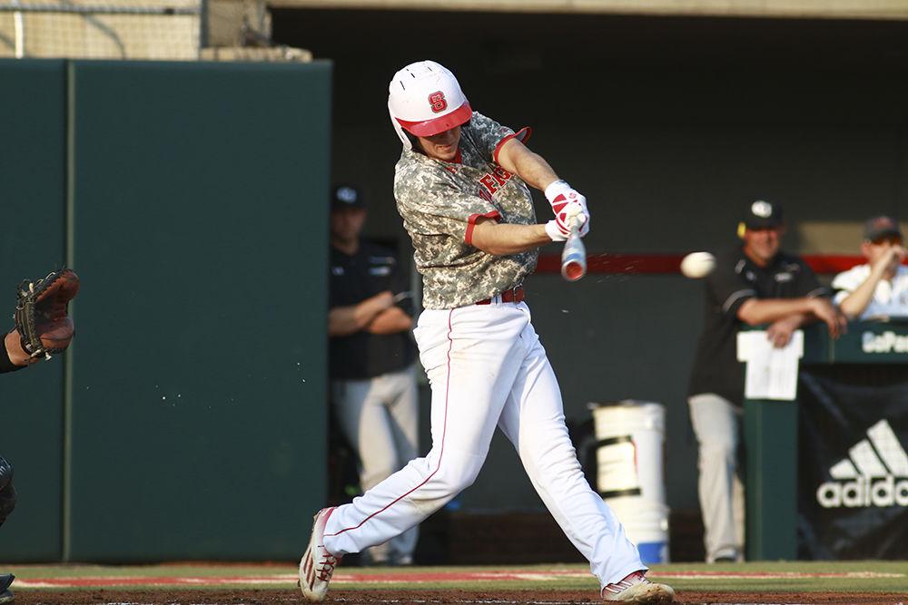 Freshman second baseman and shortstop Will Wilson crushes a pitch right down the middle in the Wolfpack's game against Campbell on Tuesday. Wilson had two runs and one hit in three at bats in the 9-8 loss at Doak Field.
&#160;