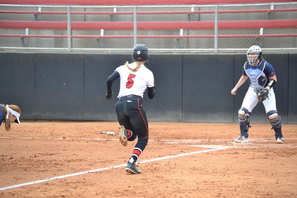 Molly Martin runs to home base to score a run against the University of Virginia on Friday, Mar. 17, 2017 in Dail Stadium. Martin helped the Wolfpack overtake Virginia with a score of 10-3.