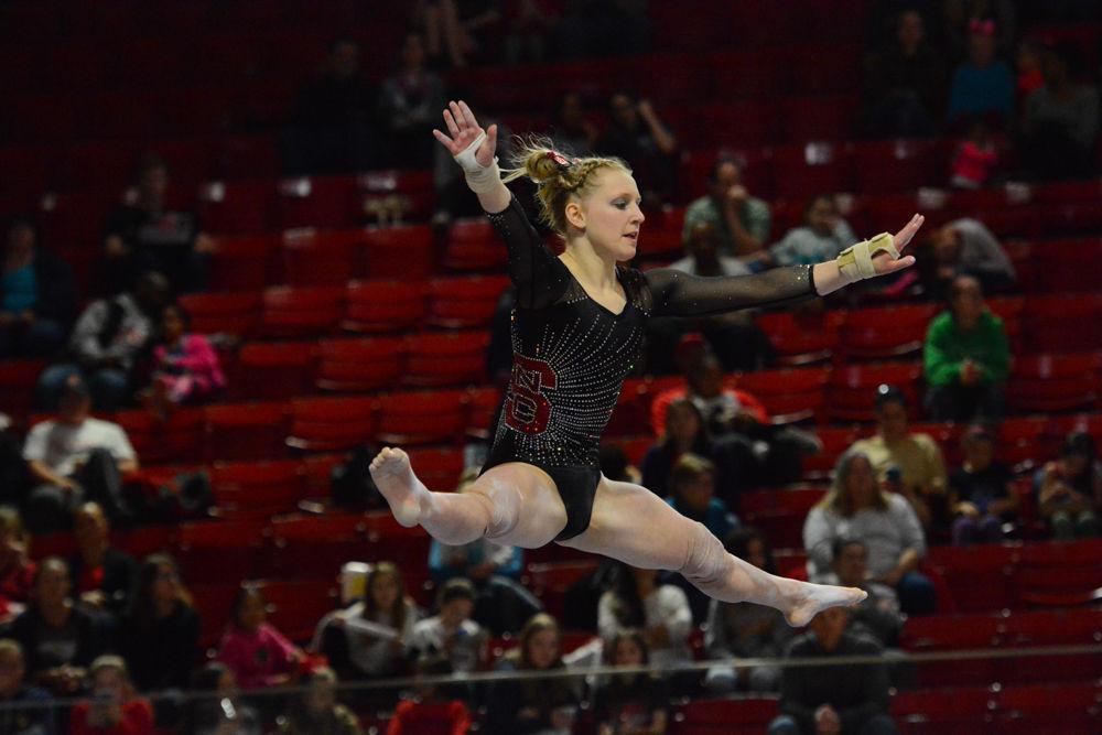 Freshman gymnast Hailey Mesmer jumps to do a split in the air while performing at the balance beam event at Reynolds Coliseum on March 18, 2017. Mesmer receives a score of 9.7 on the balance beam event. The Wolfpack won 3rd place with the score of 194.875 in the meet with George Washington University, University of New Hampshire,&#160;UNC Chapel Hill, University of Pittsburgh, and Towson University.