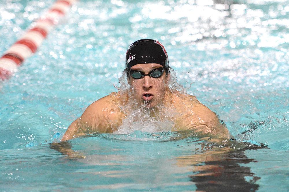 Senior Derek Hren swims the 200 yard breastroke during NC State's meet against the University of Wisconsin on Saturday, Oct. 22 in the Carmichael Aquatics Center. Hren finished first in the heat, with a time of 2:03. NC State netted the most points over the two day meet, leading them to beat Wisconsin.