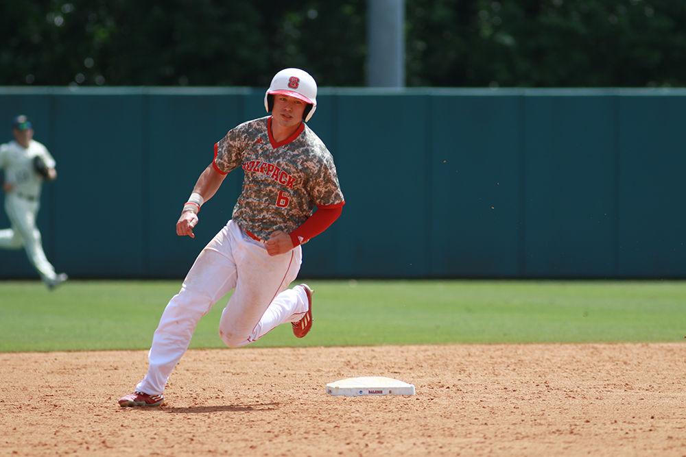 Freshman left fielder Brett Kinneman rounds second base and heads to third in the Wolfpack's third game of the NCAA Raleigh Regional against Navy on June 5. Kinneman went 3 for 4 with three runs and one RBI in the 17-1 win at Doak Field.