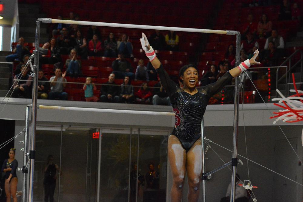 Junior gymnast Chelsea Knight poses for the landing at the uneven bars event in the Reynolds Coliseum on March 18, 2017. Knight receives 9.775 in the vault event, 9.750 in the bars event, 9.775 in the beam event, and 9.875 in the floor event which she won 2nd place in. She also won 3rd place with her all around results of 39.175. The Wolfpack won 3rd place with the score of 194.875 in the meet with George Washington University, University of New Hampshire,&#160;UNC Chapel Hill, University of Pittsburgh, and Towson University.