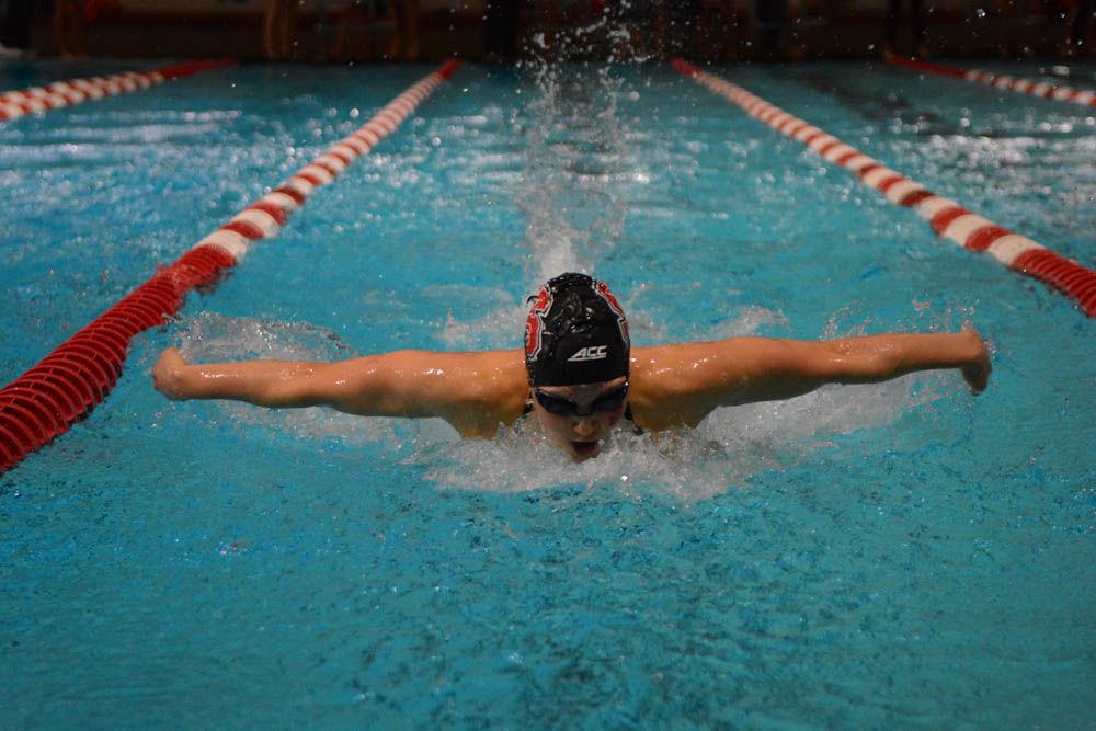 Junior Hannah Moore swims in the 200 yard butterfly against UNC-Chapel Heel at the Willis R. Casey Aquatic Center on Jan. 27, 2017. Moore came in first in the 200 yard butterfly event with the time of 1:59.06 seconds. The Wolfpack settled the meet against the Tarheels with wins in 26 of 32 events.