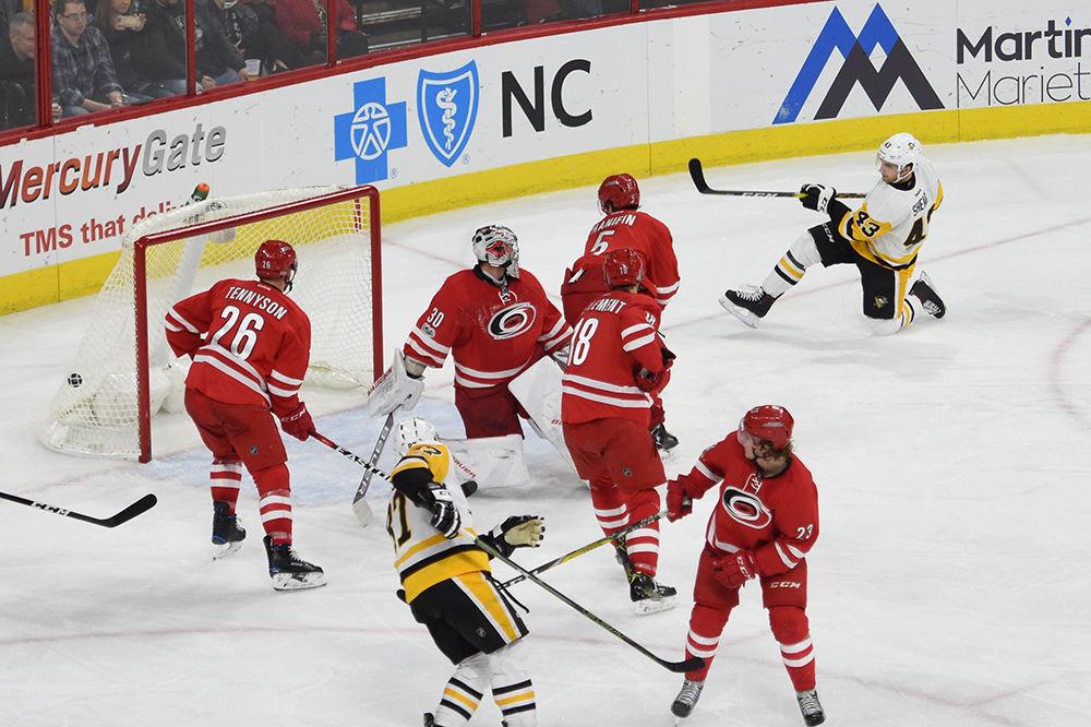 Hurricanes goalie Cam Ward gets beat by Penguins forward Conor Sheary in the third period. The Penguins defeated the Hurricanes 7-1 on Friday Jan. 20 in PNC Arena. Sheary tallied two goals for the Penguins and Ward stopped 41 shots on net.