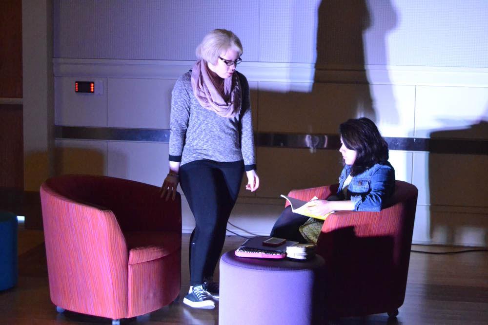 Two students act out a scene about sexual assault and blaming the victim during the Tunnel of Oppression in the State Ballroom on Wednesday, Mar. 22, 2017. Both students volunteered their time to help out with the annual event.