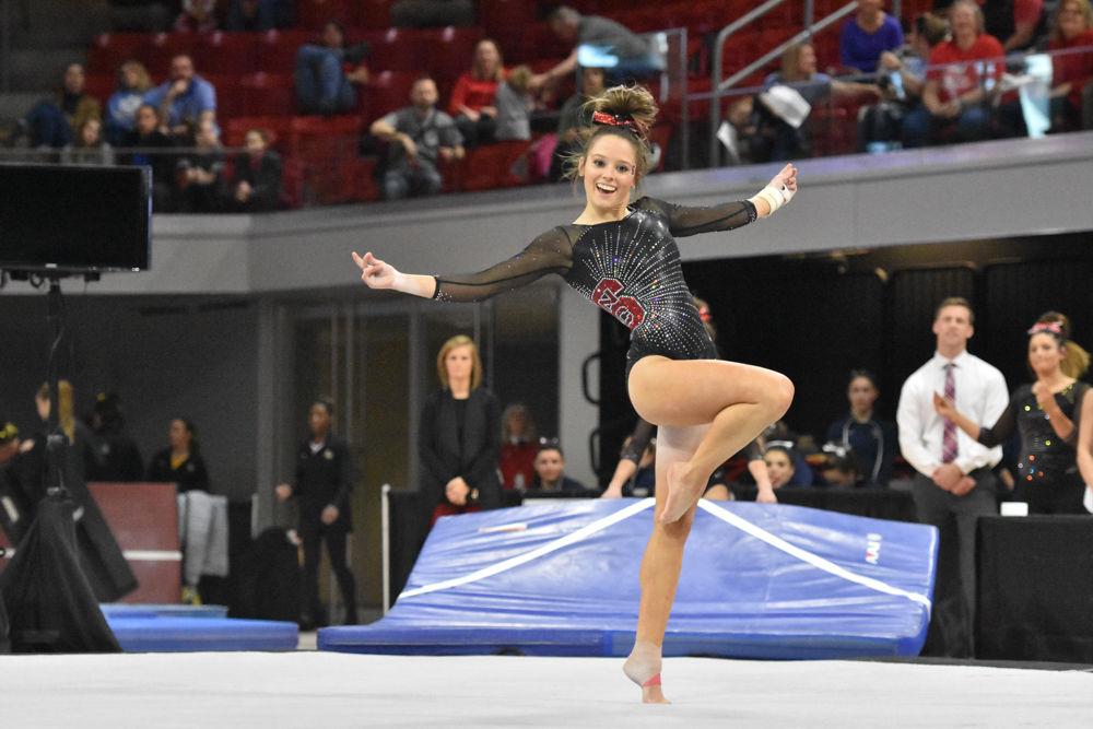 Paris Phillips, a sophomore in exploratory studies, struts across the floor during her routine during the 2017 EAGL gymnastics championship in Reynolds Coliseum on March 18. Phillips won the event with a score of 9.900.
