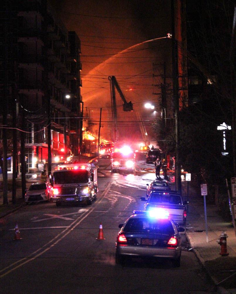 A massive fire broke out in an unfinished apartment building in downtown Raleigh on Thursday night around 10:30. The fire, which happened near Harrington Street, spread to the surrounding vegetation and rooftops of nearby buildings.